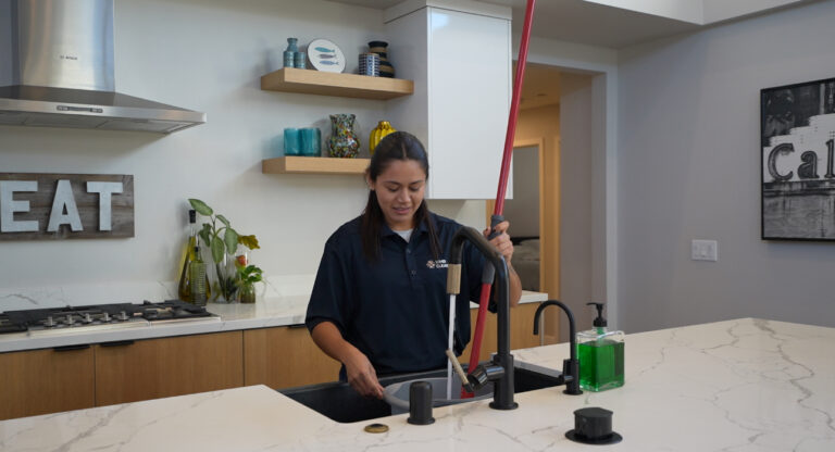WHB Cleaning team member cleaning kitchen